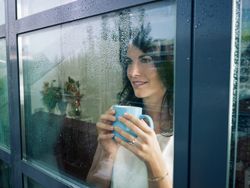 Woman looking out of the window